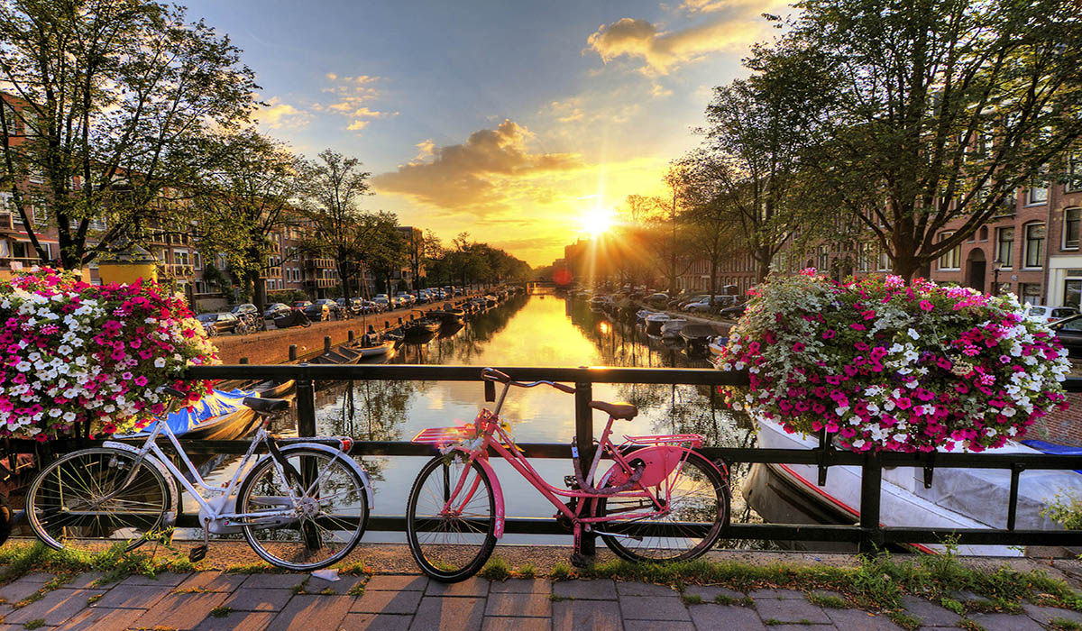 Amsterdam Amsterdam bikes over water and sunset